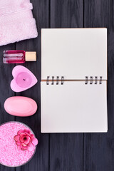 Wall Mural - Vertical shot blank notepad and spa accessories top view.