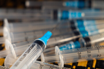 Closeup shot of a pile of medical syringes