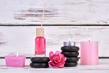 Wall Mural - Still life candles with stones and oil bottle for spa.