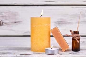 Sticker - Yellow burning candle for spa with soap and oil bottle.