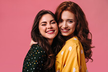 Curly Ladies In Polka Dot Blouses Smiling On Pink Background. Attractive Girlfriends With Modern Make-up Are Smiling Cute