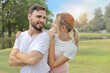 © feeling lucky - young caucasian couple are in love. man and girl wearing white shirt hugging in the park during summer season with smiling and happy face