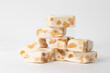 A pile of traditional nougat on white background.