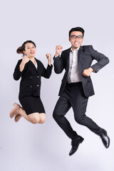 Sticker - Businessman and business woman jumping on white background