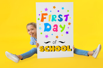 Sticker - Funny little girl holding poster with text FIRST DAY OF SCHOOL on color background