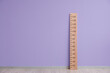 Big ruler for height measuring near color wall