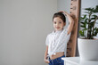 © Pixel-Shot - Little girl measuring height at home