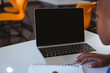 © WavebreakMediaMicro - African american schoolboy sitting at desk in classroom using laptop, with copy space on screen