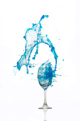 Wine glass on white background whit a blue water splash.