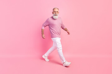 Poster - Photo of handsome attractive mature man dressed pullover glasses smiling walking isolated pink color background