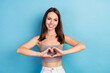 © deagreez - Photo of adorable pretty young lady wear grey top showing fingers heart smiling isolated blue color background