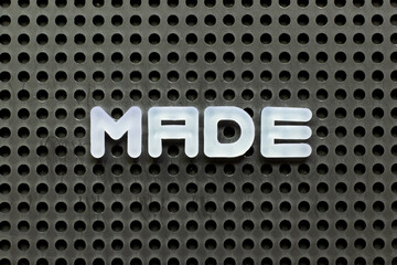 Sticker - White color letter in word made on black pegboard background