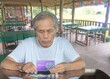 ©  Mushroom House - senior looking at the passbook
