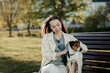 © jozzeppe777 - Woman playing with dog on bench