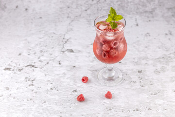 Wall Mural - a glass of homemade raspberry berry lemonade with ice cubes