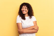 © Asier - Young mixed race woman isolated on yellow background smiling confident with crossed arms.