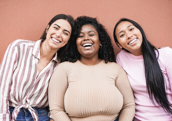 Wall Mural - Happy latin women with different skin color looking in camera - Concept of multiracial people, friendship and happiness