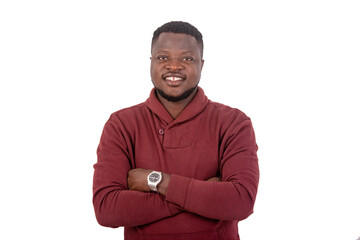 happy young man crossing his arms smiling.