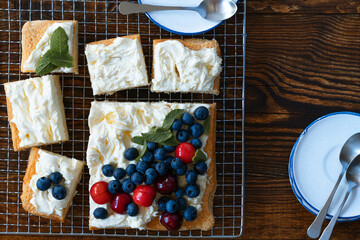 Wall Mural - Sponge cake with fresh summer berries and cream