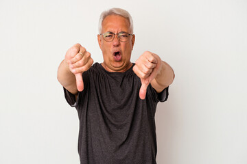 Wall Mural - Senior american man isolated on white background showing thumb down and expressing dislike.