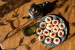 Traditional Moroccan handmade cookies in a ceramic plate on a wooden table.