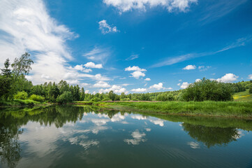 Wall Mural - calm river. clouds reflection on lake