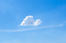 Single White Cloud That Look Like Snail In Bright Blue Sky In Summertime.