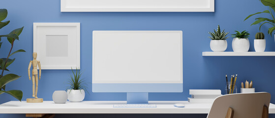 Blue wall working room with computer monitor, white desk and office supplies