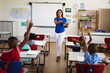 © WavebreakMediaMicro - African american female teacher with digital tablet teaching in the class at elementary school