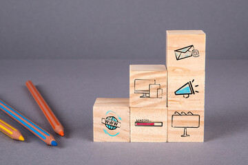Wall Mural - Email Marketing concept. Wooden blocks with icons on a gray background