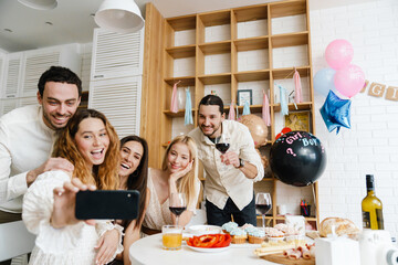 Wall Mural - Happy young pregnant woman celebrating baby shower