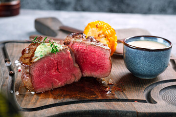 Wall Mural - Filet Mignon steak, grilled medium rare. Sliced fried beef tenderloin close-up