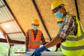 Aufkleber - Engineer man working with drawings inspection in workplace at construction site,Architect Design Project Meeting Discussion Concept.