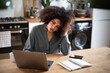 © ReeldealHD images - Stressed African American businesswoman working from home