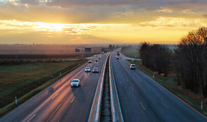 Wall Mural - Highway transportation with cars at sunset traffic