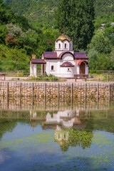 Wall Mural - A new temple-chapel on the lake in the village of Stroentsy, built in the image of a temple from the holy land of Athos, Transnistria, Moldova