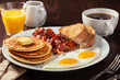 traditional full american breakfast eggs pancakes with bacon and toast