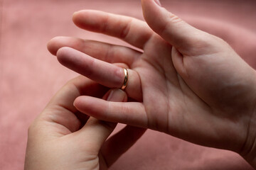 Wall Mural - girl can not remove wedding ring close-up