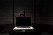 © Daniel Ingold/Westend61 - Laptop placed on black desk in office