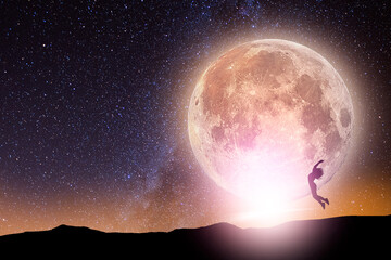 Wall Mural - Fantasy landscape. The full moonrise over the hill. The girl silhouette  jumping on the full moon on the starry background