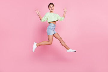 Wall Mural - Full body profile side photo of young girl happy positive smile jump up wave hello isolated over pastel color background