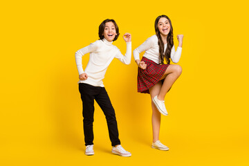 Canvas Print - Full length body size photo of children dancing happy won lottery isolated bright yellow color background