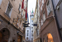 Austria, Salzburg State, Salzburg, Getreidegasse Street With Clock Tower Of Old City Hall In Background
