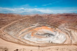 View from above of the pit of an open-pit copper mine in Peru