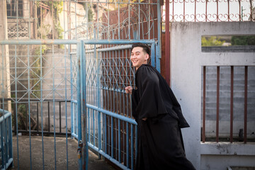 A man acting cerebrate for Graduate Faculty of Pharmacy in University of Thailand.