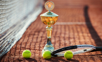 Wall Mural - Tennis balls with a racket and cup on the tennis court. Sport, recreation concept