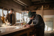 © Cavan Images - Men working with wood in joinery