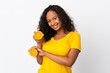 © luismolinero - Teenager cuban girl isolated on white background holding an orange