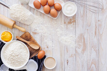 Homemade Dough Recipe (eggs, Flour, Milk, Sugar) On A Wooden Table Top View.