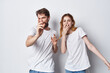© SHOTPRIME STUDIO - cheerful young couple in white t-shirts having fun together friendship